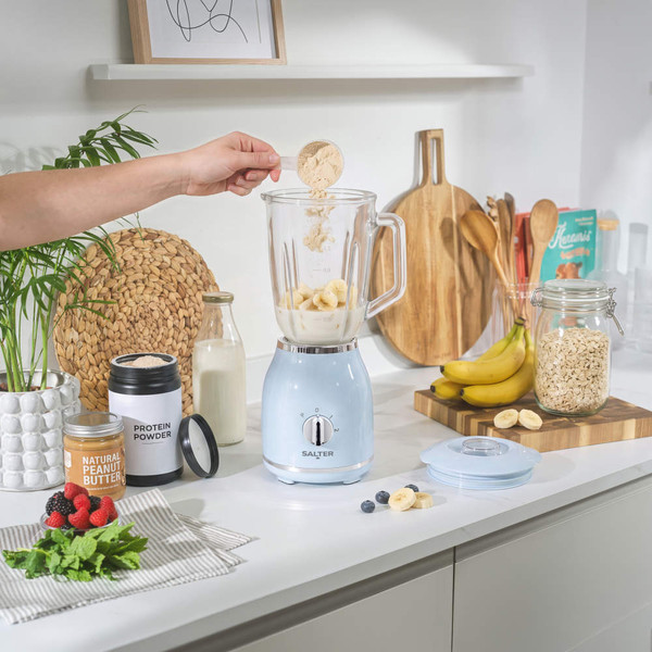 Pale blue electric blender base and glass jug with lid, shown separately