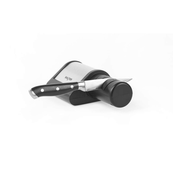 Electric knife sharpener in black and silver with kitchen knife inserted
