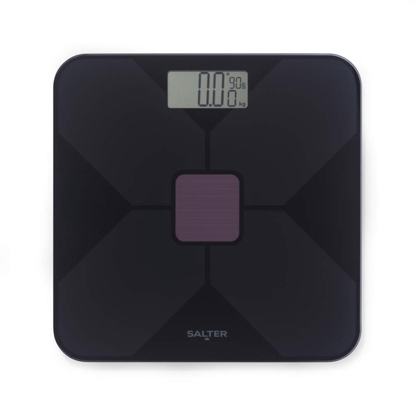 Black digital bathroom scale with solar panel, top-down view