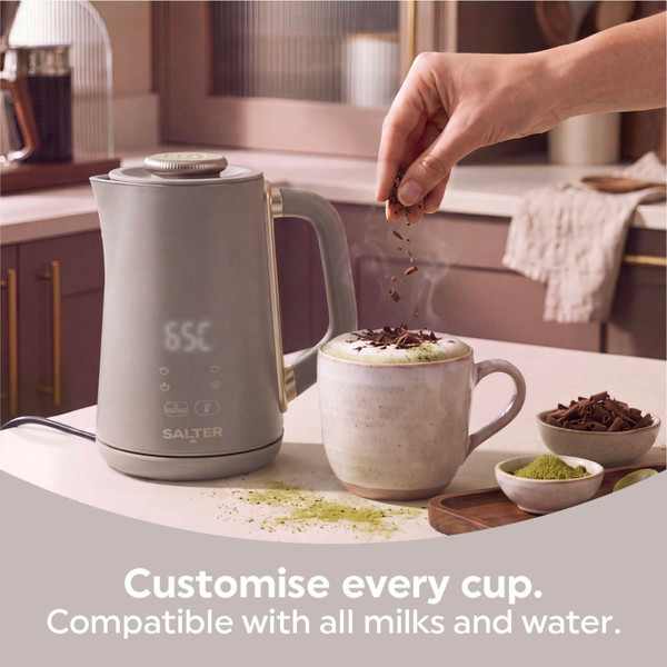 Salter milk frother beside a mug topped with chocolate shavings