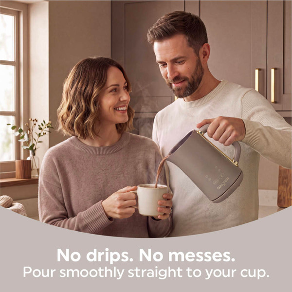 Brown electric kettle pouring into a mug in a kitchen