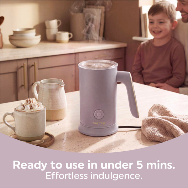 Purple milk frother pouring hot chocolate into matching mug, product use display