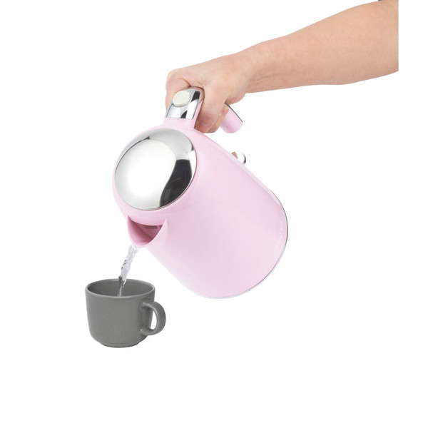 Pink electric kettle pouring hot water into grey mug, shown in use.