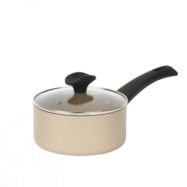 Gold saucepan with glass lid and black handle