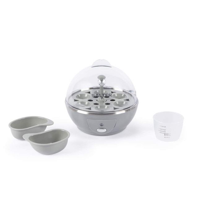 Grey electric egg cooker with clear lid, two poaching trays and measuring cup