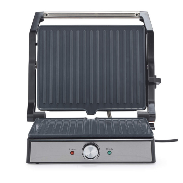 Electric panini grill with silver finish, open to show non-stick ribbed plates