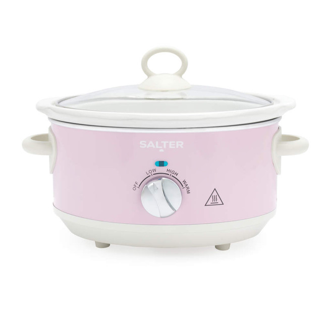 Pink electric slow cooker with lid and dial, shown from front.