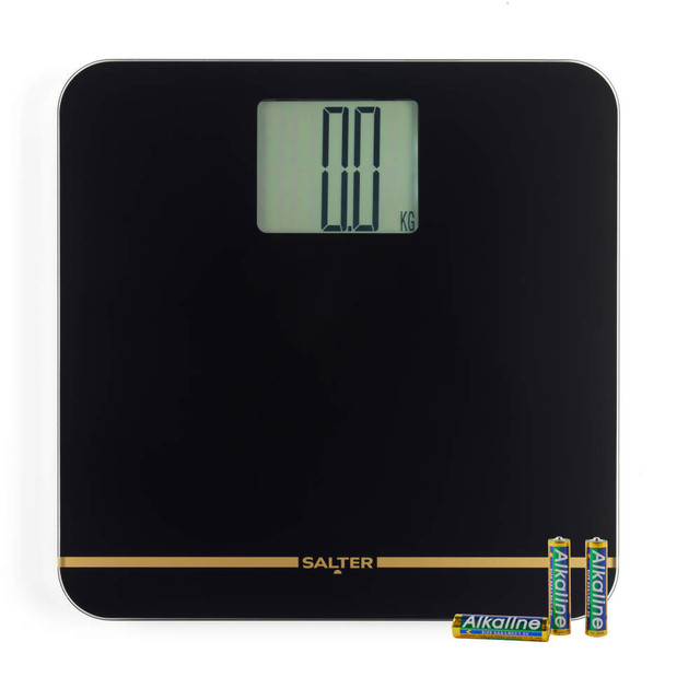 Black digital bathroom scale with large display, supplied with four alkaline batteries.
