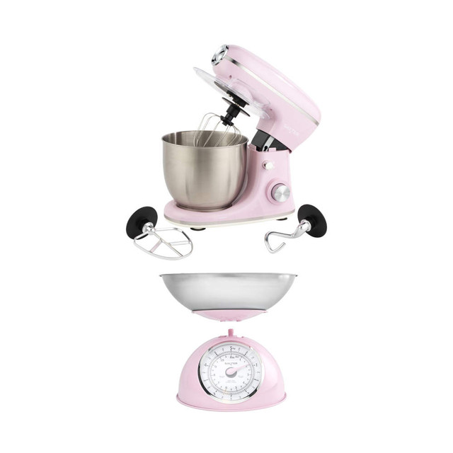 Pink stand mixer with metal bowl and baking attachments, shown above a matching pink kitchen scale