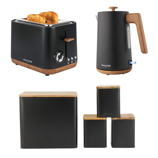 Matte black toaster, kettle, and storage canisters set with wood accents
