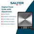 Digital kitchen scale weighing brown sugar in glass bowl, baking ingredients around