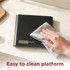 Black digital kitchen scale being wiped clean
