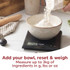 Digital kitchen scales weighing flour in a bowl, display shows 250g.