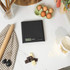 Boxed Salter Arc Electronic Kitchen Scale, black, with bowl of berries on front