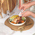Clear acrylic salt and pepper mills on kitchen shelf