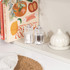 Set of clear acrylic salt and pepper mills on kitchen worktop