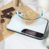 White digital kitchen scale with black Salter logo, large display, top view.