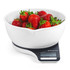 White digital kitchen scale with a bowl of fresh strawberries on display