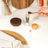 Pair of Salter salt and pepper mills with wooden tops on kitchen shelf