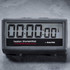 Digital kitchen timer with large display in black case, showing zero hours and minutes.