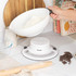 White mechanical kitchen scale weighing flour in a bowl on countertop