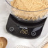 Digital kitchen scale with clear mixing bowl, displaying 500g of milk.