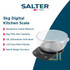 Digital kitchen scale with mixing bowl measuring brown sugar on kitchen worktop
