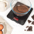 Black electronic kitchen scale with digital display, 10kg capacity, Salter brand