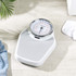 Mechanical bathroom scale with grey platform and large Salter dial