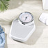 White mechanical bathroom scale with large easy-read dial, shown on tiled floor