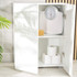 Mechanical bathroom scale with textured white surface, close-up of dial display