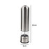Stainless steel salt and pepper grinders on dining table set for roast dinner