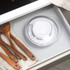 Salter mechanical kitchen scale in drawer, clear bowl, shown beside wooden utensils