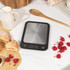 Salter digital kitchen scale, part view showing silver surface and zero display