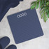 Digital blue bathroom scale with textured surface on tiled floor, display reads 0000