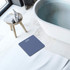 Digital bathroom scale in blue on tiled floor beside bath