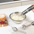 Salter hand blender whisking cream in metal bowl on kitchen counter