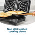 Black Salter sandwich toaster open on kitchen counter, showing toasted sandwiches inside.