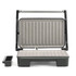 Grey electric grill with open non-stick plates and removable drip tray