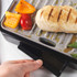 Grey electric grill with open non-stick plates and removable drip tray