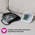 Digital blood pressure monitor with cuff on sofa, promoting arrhythmia detection feature.