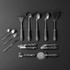 Salter 15-piece kitchen utensil and gadget set in black, arranged on a dark background