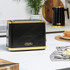 Black and gold Salter toaster on kitchen counter, shown with matching kettle in background.
