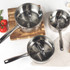 Set of three silver stainless steel saucepans, stacked with lid, shown from side
