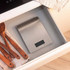 Digital kitchen scale with brushed steel finish on worktop, shown with baking ingredients