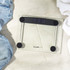 Glass digital bathroom scale with black accents on tiled floor