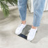 Glass digital bathroom scale on tile floor, Salter brand, display reads zero
