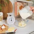 White mechanical kitchen scale with clear dial, shown stored in a drawer