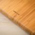 Close-up of bamboo digital scale corner showing USB-C charging port