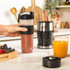Salter black and silver blender set with jug, smoothie cup, and fresh fruit ingredients.